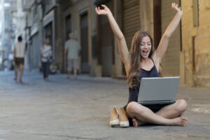 Photo by Andrea Piacquadio: https://www.pexels.com/photo/woman-raising-her-hands-up-while-sitting-on-floor-with-macbook-pro-on-lap-3813341/